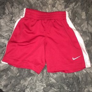 Red and white baby Nike shorts